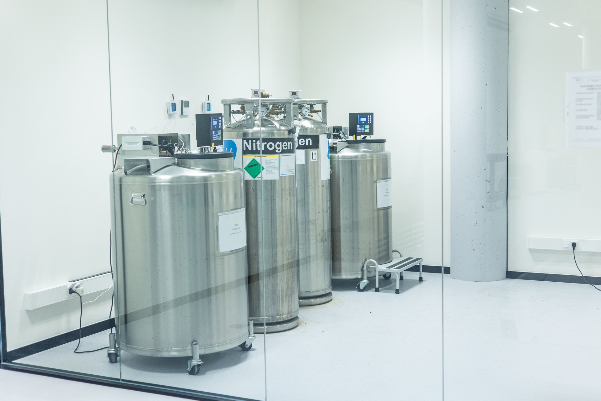 Liquid nitrogen tanks storing biological samples in scientific laboratory
